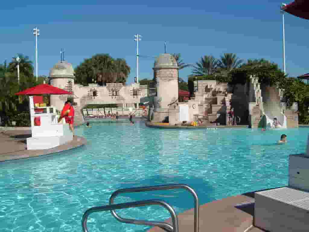 Elegant Disney Beach Club Villas exterior showcasing charming architecture and lush landscaping.
