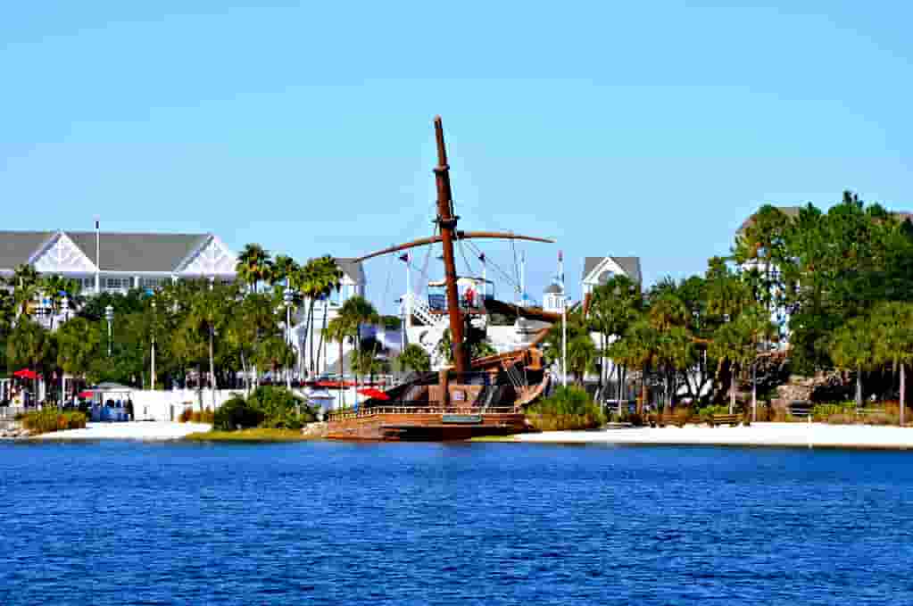 Elegant exterior of Disney's Beach Club Villas DVC resort with lush landscaping.